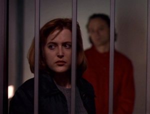 Dana_Scully_is_watched_by_Luther_Lee_Boggs
